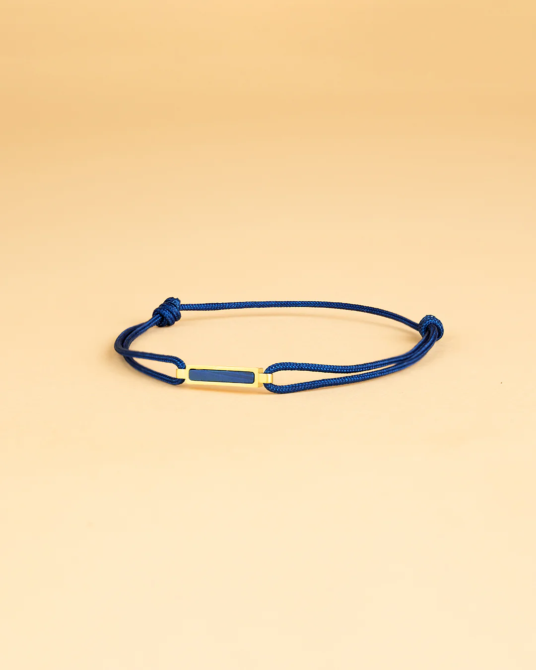 Blue nylon bracelet with a gold-plated Blue Tiger Eye element