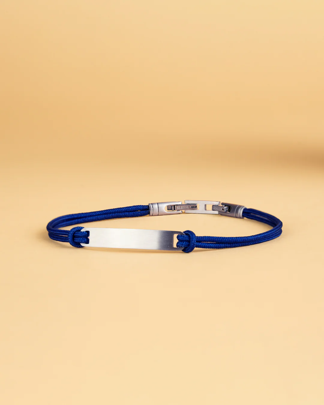 Blue nylon bracelet with an engraving plate