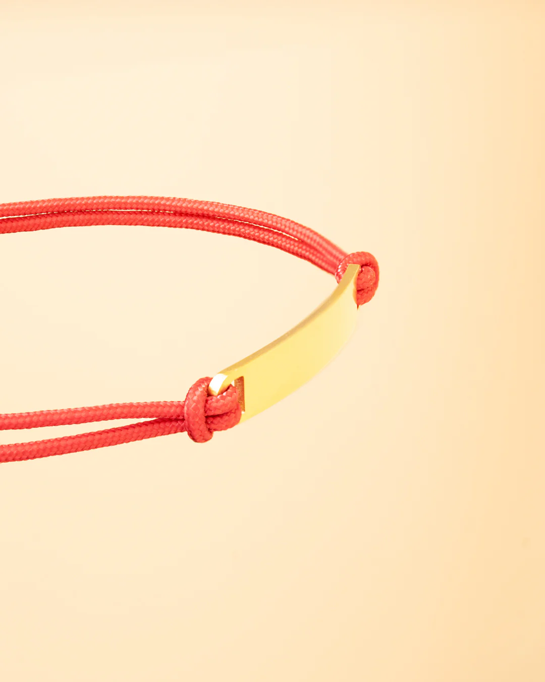 Red nylon bracelet with a gold-plated engraving plate - Image 2