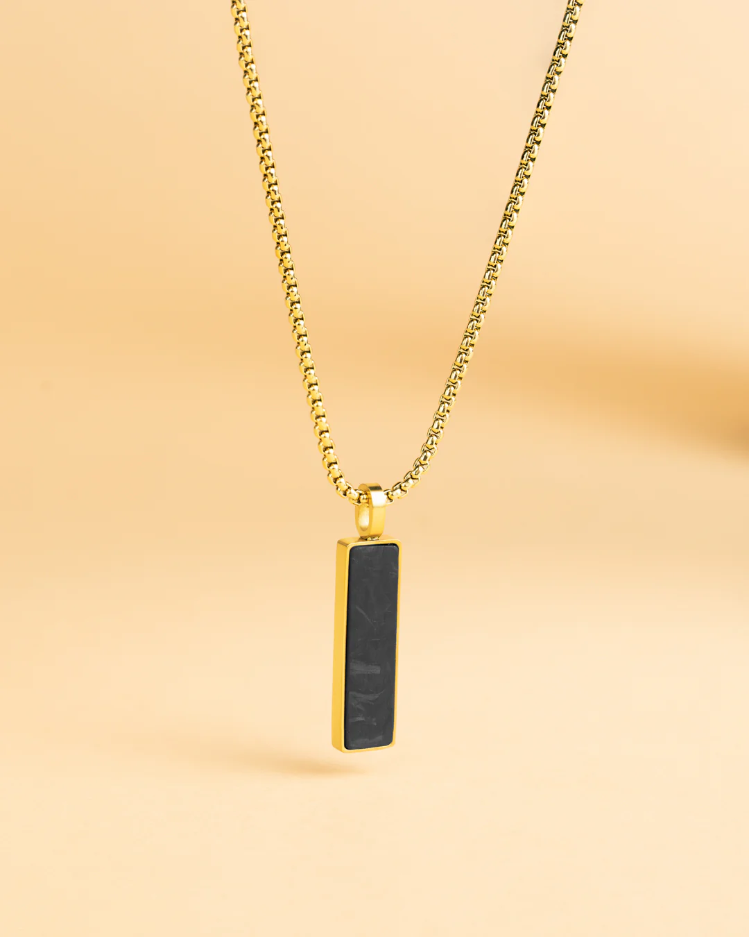 Gold-plated stainless steel necklace with a forged carbon finish